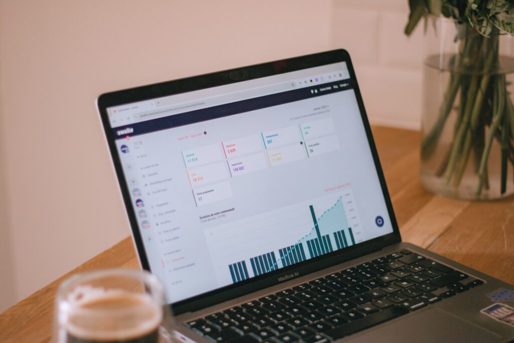 Laptop displaying website analytics and performance metrics.